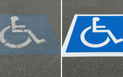 High-visibility blue and white handicap parking lines painted for accessibility.