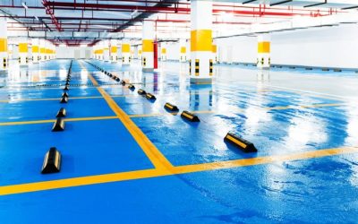 Brightly painted parking space lines in a modern, clean underground garage.
